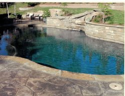 <div class='closebutton' onclick='return hs.close(this)' title='Close'></div><div class='firstH'><img src='images/logo-white-small.png'></div><h1>Custom Concrete</h1><p>Custom Concrete #050 by Pool Tron</p><div class='getSocial'><h1>Share</h1><p class='photoBy'>Photo by Pool Tron</p><iframe src='http://www.facebook.com/plugins/like.php?href=http%3A%2F%2Fpooltron.com%2Fimages%2Fgalleries%2Fcustom-concrete%2Fwm%2Fcustom-concrete-pool-by-pool-tron-050.jpg&send=false&layout=button_count&width=100&show_faces=false&action=like&colorscheme=light&font&height=21' scrolling='no' frameborder='0' style='border:none; overflow:hidden; width:100px; height:21px;' allowTransparency='true'></iframe><br><a href='http://pinterest.com/pin/create/button/?url=http%3A%2F%2Fwww.pooltron.com&media=http%3A%2F%2Fwww.pooltron.com%2Fimages%2Fgalleries%2Fcustom-concrete%2Fwm%2Fcustom-concrete-pool-by-pool-tron-050.jpg&description=Pools' data-pin-do='buttonPin' data-pin-config=\'above\'><img src='http://assets.pinterest.com/images/pidgets/pin_it_button.png' /></a><br></div>
